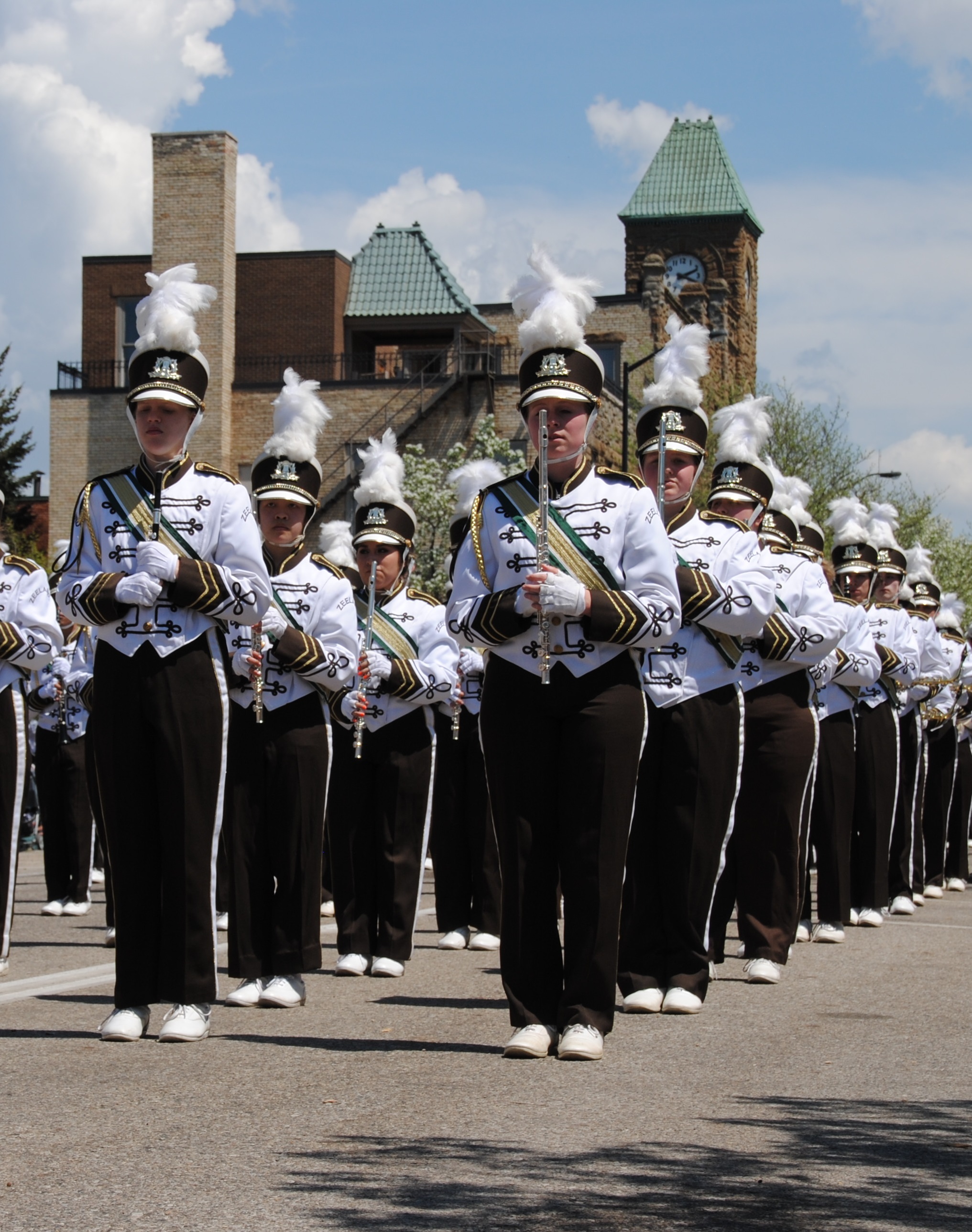 High schoool band members marching in a parade
